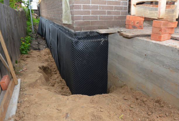 SJ Waterproofing Pros technician performing targeted Emergency Waterproofing assessment in Bayville, NJ